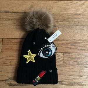 Pompon hat with appliqués